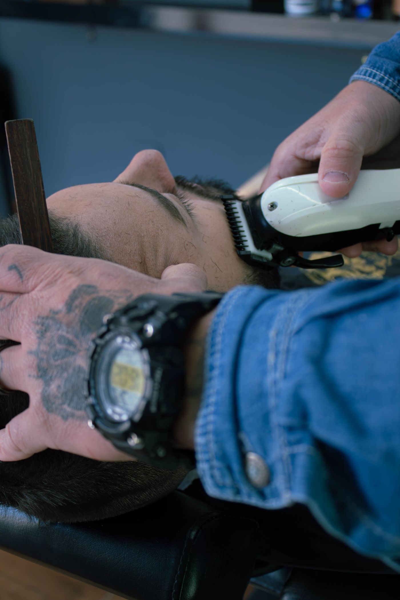 Barber working on beard